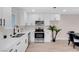 Modern kitchen with white shaker cabinets and stainless steel appliances at 1747 Jupiter Ct # D, Las Vegas, NV 89119