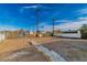 Backyard with a stone pathway and a chain-link fence at 1940 Walker St, Las Vegas, NV 89106