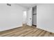 Bedroom with vinyl plank flooring and sliding closet doors at 1940 Walker St, Las Vegas, NV 89106