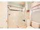 Shower stall with glass door and shelving unit at 337 Lingering Ln, Henderson, NV 89012