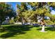 Landscaped lawn area with mature trees and ample green space at 3777 Garden North Dr, Las Vegas, NV 89121