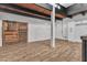 Open living area features a rustic barn door and wood flooring at 3777 Garden North Dr, Las Vegas, NV 89121