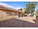 Large backyard with gravel and mature trees at 3973 El Camino Rd, Las Vegas, NV 89103