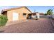 Large backyard with gravel and covered patio area at 3973 El Camino Rd, Las Vegas, NV 89103