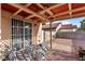 Covered patio with wrought iron furniture and tile flooring at 3973 El Camino Rd, Las Vegas, NV 89103