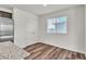 Bright dining area with wood-look floors and access to kitchen at 6952 Crescent Gold St, North Las Vegas, NV 89086