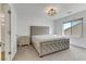 Elegant bedroom with upholstered headboard and nightstand at 7180 Grace Estate Ave, Las Vegas, NV 89113