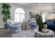 Cozy living space featuring blue velvet armchairs and a circular coffee table at 7436 Silent Sage Dr, Las Vegas, NV 89149