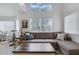 Living room with sectional sofa and high ceilings at 8001 Delightful Ave, Las Vegas, NV 89128