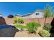 Landscaped backyard with artificial turf and gravel at 8284 Southern Cross Ave, Las Vegas, NV 89131