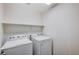 Laundry room with washer and dryer, and overhead shelving at 8284 Southern Cross Ave, Las Vegas, NV 89131