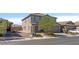 Two-story house with a neutral color scheme and a landscaped yard at 8753 Vermont Vista St, Las Vegas, NV 89113