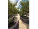 Landscaped backyard with a curved pathway and various plants at 8840 Aurora Light Way, Las Vegas, NV 89123