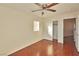 Bedroom with hardwood floors, ceiling fan, and sliding door closet at 9512 Canyonland Ct, Las Vegas, NV 89147