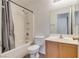 Bathroom with shower/tub combo and wood vanity at 9978 Coral Cameo Ct, Las Vegas, NV 89183