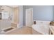 Spa-like bathroom with soaking tub and walk-in shower at 10809 Sleepy River Ave, Las Vegas, NV 89144