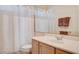 Bathroom with shower/tub combo and wood vanity at 10809 Sleepy River Ave, Las Vegas, NV 89144