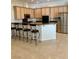 Kitchen with light wood cabinets and granite counters at 10809 Sleepy River Ave, Las Vegas, NV 89144