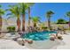 Inviting pool with waterfall feature and spa at 10809 Sleepy River Ave, Las Vegas, NV 89144