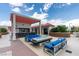 Outdoor patio area with fire pit, seating, and a bar at 200 W Sahara Ave # 3008, Las Vegas, NV 89102