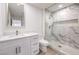 Elegant bathroom with marble shower, modern vanity, and updated fixtures at 2133 Hallston St, Las Vegas, NV 89134