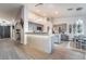 Bright kitchen features an island, gray cabinets, and stainless steel appliances at 2144 Paganini Ave, Henderson, NV 89052