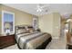 King-size bed in spacious bedroom with ensuite bathroom access at 2360 Hardin Ridge Dr, Henderson, NV 89052