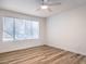 Spacious bedroom with large window and wood-look floors at 3425 E Russell Rd # 264, Las Vegas, NV 89120