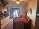 Bright dining room with a large table and access to the kitchen at 3805 Rolling Cloud Dr, Las Vegas, NV 89115