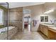 Bathroom with a walk-in shower, bathtub and double sinks at 3906 Jacob Lake Cir, Las Vegas, NV 89118