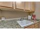 Laundry room with utility sink and ample counter space at 3906 Jacob Lake Cir, Las Vegas, NV 89118