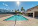 Community pool with lounge chairs and patio area at 4390 Sandy River Dr # 1, Las Vegas, NV 89103