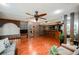 Living room with hardwood floors, wet bar, and ceiling fan at 4670 Monterey Cir # 1, Las Vegas, NV 89169