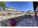 Landscaped backyard with stone planters and pathway at 5132 Springland St, Las Vegas, NV 89146