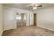 Bright bedroom with mirrored closet doors and ceiling fan at 5132 Springland St, Las Vegas, NV 89146