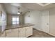 Kitchen boasts granite countertops, white cabinets, and access to a patio at 5132 Springland St, Las Vegas, NV 89146