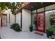 Stylish red front door with sidelights, and a welcoming entry at 515 Serenity Point Dr, Henderson, NV 89012