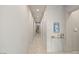 Bright hallway with light gray walls and tile flooring at 515 Serenity Point Dr, Henderson, NV 89012