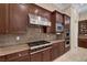 Well-equipped kitchen with stainless steel appliances and granite countertops at 6 Caves Valley Ct, Henderson, NV 89052