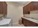 Laundry room with washer, dryer, and ample cabinet storage at 6 Caves Valley Ct, Henderson, NV 89052