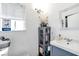 Bathroom with grey vanity and window with blinds at 6373 Enchanting Ct, Las Vegas, NV 89156