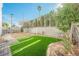 Landscaped backyard with artificial turf and block wall at 6501 Old Oxford Ave, Las Vegas, NV 89108