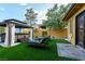 Relaxing backyard oasis with spa, gazebo, and lounge chairs at 8223 Windrush Ave, Las Vegas, NV 89117