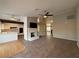 Bright living room with tile floors, fireplace, and kitchen views at 8608 Alfano Ct, Las Vegas, NV 89117