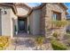 Inviting entryway with stone accents and landscaping at 8648 Cloverbelle St, Las Vegas, NV 89166