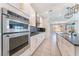 Modern kitchen with stainless steel appliances and white cabinetry at 8648 Cloverbelle St, Las Vegas, NV 89166