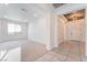 Bright and airy living room with tile floors and carpet at 8648 Cloverbelle St, Las Vegas, NV 89166