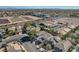 Aerial view of a neighborhood with a house and solar panels at 9309 Deer Lodge Ln, Las Vegas, NV 89129