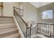 Upstairs hallway showcasing a modern staircase and natural light at 9309 Deer Lodge Ln, Las Vegas, NV 89129