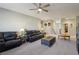 Open living room with ceiling fan and ample natural light at 996 Alverstone Ct, Henderson, NV 89002